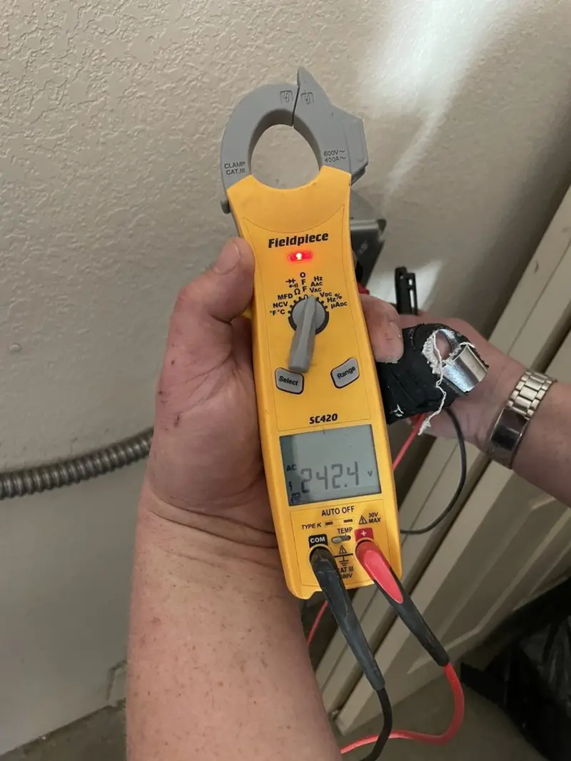 Voltage testing with clamp meter during Recessed Lighting Installation in Seabrook